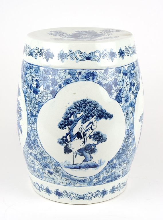 A CHINESE STYLE BLUE AND WHITE GARDEN SEAT: A CHINESE STYLE BLUE AND WHITE GARDEN SEAT Of contemporary production, centering four medallions with alternating cranes and blossoms motifs on a blue millefleur ground, the top with floral motif. H 1