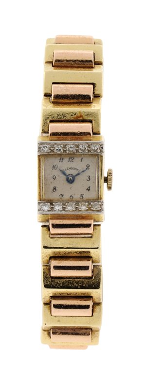 A SWISS OLLENDORFF LADY'S 14K YELLOW AND ROSE GOLD: A SWISS OLLENDORFF LADY'S 14K YELLOW AND ROSE GOLD WRIST WATCH The face with Arabic hours, marked at center Ollendorff and at lower center Swiss, and having two opposing rows of five diamonds at each 