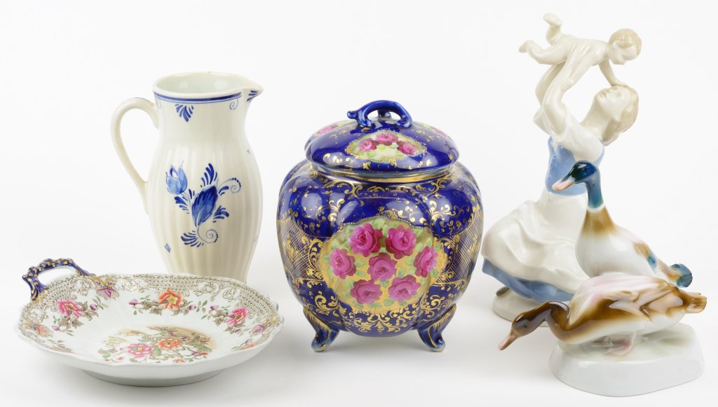 AN ASSEMBLED COLLECTION OF ENGLISH AND CONTINENTAL: AN ASSEMBLED COLLECTION OF ENGLISH AND CONTINENTAL CERAMIC FIGURES Comprising an English Ironstone transfer decorated and polychromed dish, the base marked "Dresden China," a French porcelain cobalt g