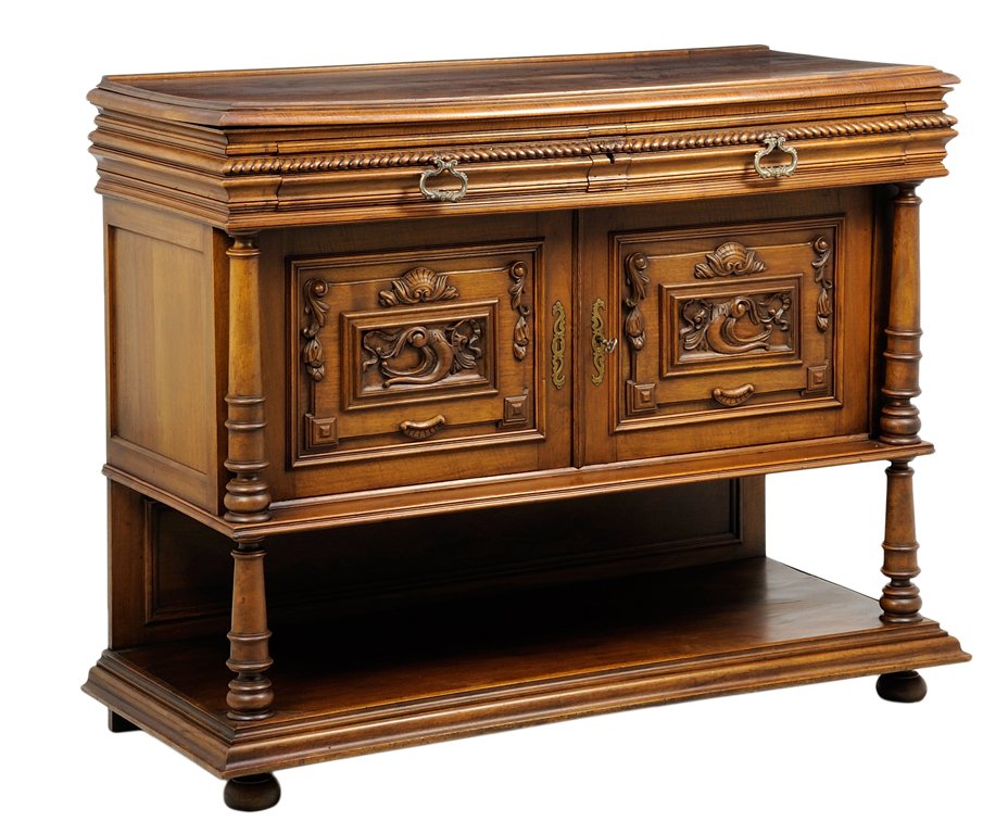 A RENAISSANCE REVIVAL SIDEBOARD: A RENAISSANCE REVIVAL SIDEBOARD The sideboard having a rectangular top over the conforming case, fitted with two short drawers over two paneled doors, carved with acanthus leaf and shell decoration, f