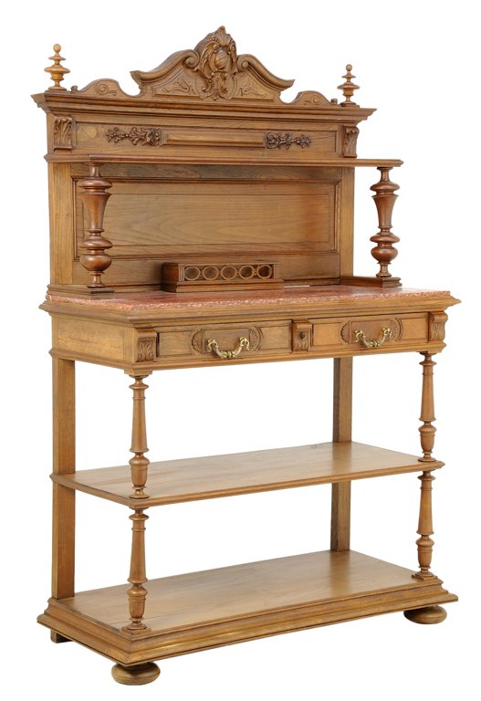 A RENAISSANCE REVIVAL SERVER: A RENAISSANCE REVIVAL SERVER The server with two drawers, flared cornice set with two turned finials above the foliate carved frieze, raised on turned supports, inset marble top, the whole set on a pl