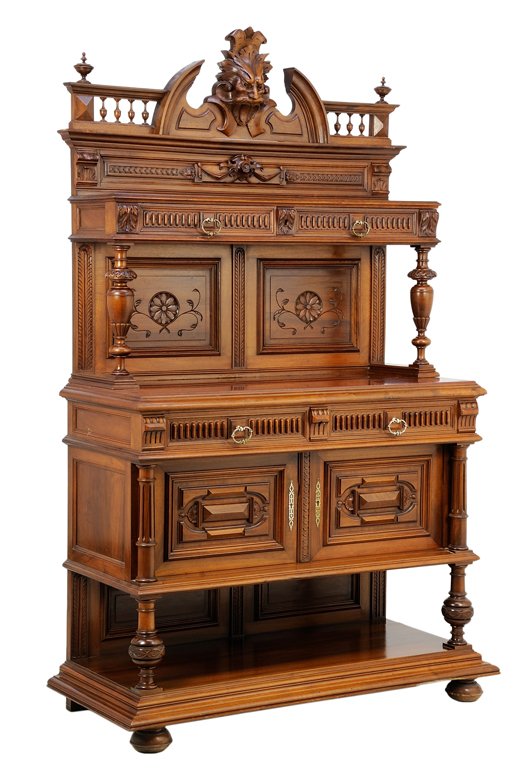 A RENAISSANCE REVIVAL SIDEBOARD: A RENAISSANCE REVIVAL SIDEBOARD The sideboard having a galleried cornice centered with a broken arch pediment and a griffin mask crest, over two drawers, raised on baluster form supports, over the rec