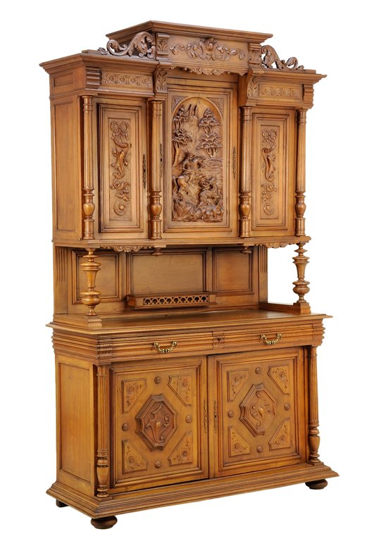 A RENAISSANCE REVIVAL WALNUT BUFFET A DEUX CORPS: A RENAISSANCE REVIVAL WALNUT BUFFET A DEUX CORPS The buffet a deux corps having a stepped cornice surmounted with a foliate carved frieze, flanked by scrolling acanthus leaves, above three paneled doo