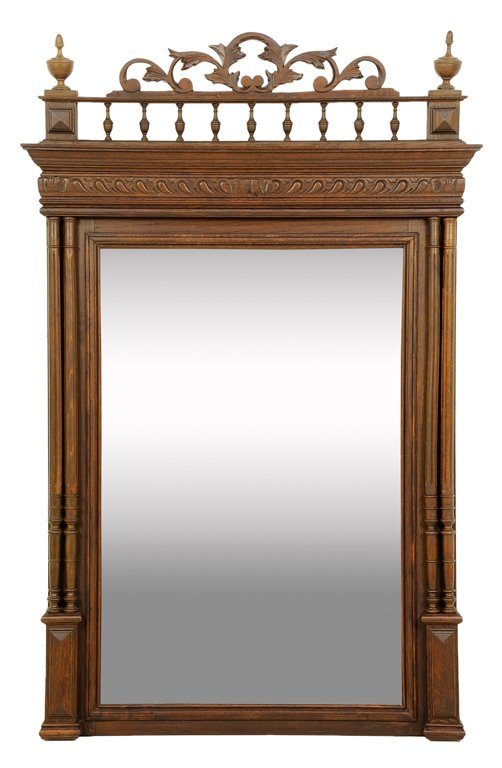A RENAISSANCE REVIVAL PIER MIRROR: A RENAISSANCE REVIVAL PIER MIRROR The stepped cornice having a turned vasiform upper gallery surmounted by pierced carved acanthus leaves and finials above the rectilinear mirror flanked by engaged, t