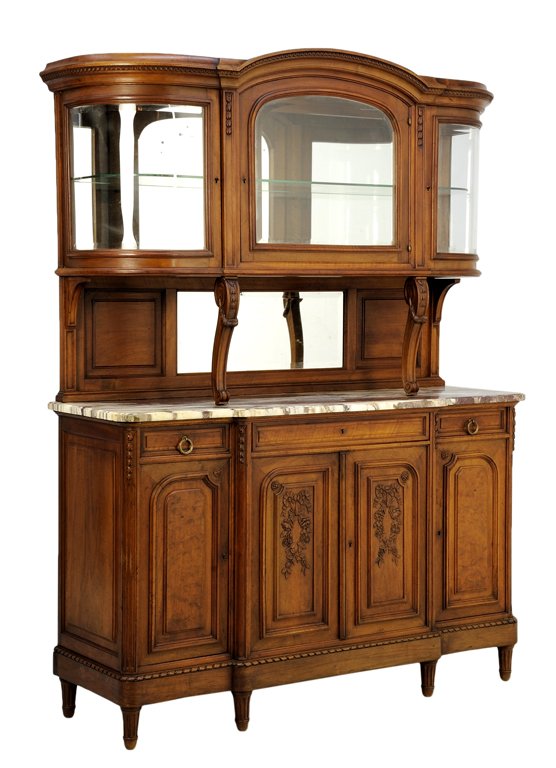 A FRENCH LOUIS XVI STYLE BUFFET A DEUX CORPS: A FRENCH LOUIS XVI STYLE BUFFET A DEUX CORPS The buffet a deux corps having a demilune shaped cornice over three glazed doors, opening to a shelved interior, raised on scrolled supports, over the rect