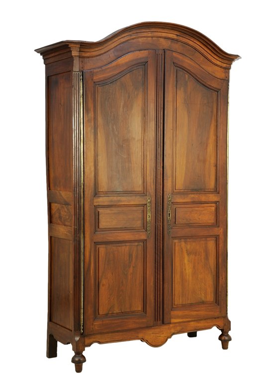 A FRENCH LOUIS XVI STYLE ARMOIRE: A FRENCH LOUIS XVI STYLE ARMOIRE The armoire having a domed pediment over two paneled doors, coffer paneled sides, above the shaped apron, raised on toupie fore feet. H 97½ x W 60½ x D 24 inches.