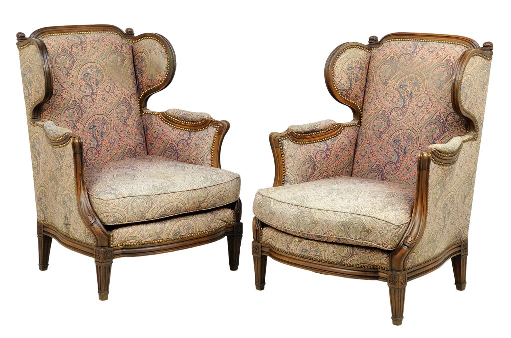 A PAIR OF FRENCH LOUIS XVI WINGBACK ARMCHAIRS: A PAIR OF FRENCH LOUIS XVI WINGBACK ARMCHAIRS The armchairs having a curved crest rail over the upholstered back, arms and seat, over the straight apron, raised on tapering cylindrical legs. H 37½ x 
