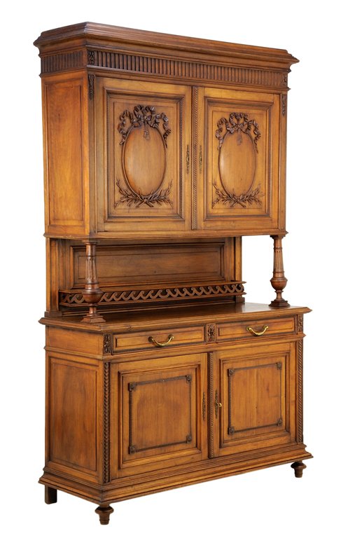 A FRENCH LOUIS XVI STYLE BUFFET A DEUX CORPS: A FRENCH LOUIS XVI STYLE BUFFET A DEUX CORPS The buffet a deux corps having a stepped cornice over the carved frieze, above two paneled doors carved with ribbon-tied decoration, raised on baluster for