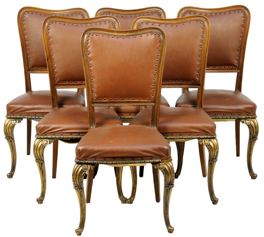 A SET OF SIX ITALIAN GILTWOOD DINING CHAIRS: A SET OF SIX ITALIAN GILTWOOD DINING CHAIRS Each chair having a curved crest rail over the upholstered back and seat with nailhead border, raised on giltwood cabriole legs, ending in shaped feet. H 39