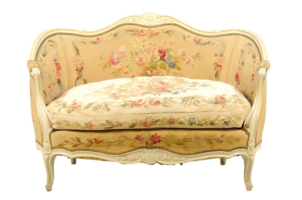 A FRENCH LOUIS XV STYLE PAINTED SETTEE: A FRENCH LOUIS XV STYLE PAINTED SETTEE The settee having a curved crest rail centered with carved shell decoration, over the upholstered back, and stuff-over seat, with nailhead border, above the shap