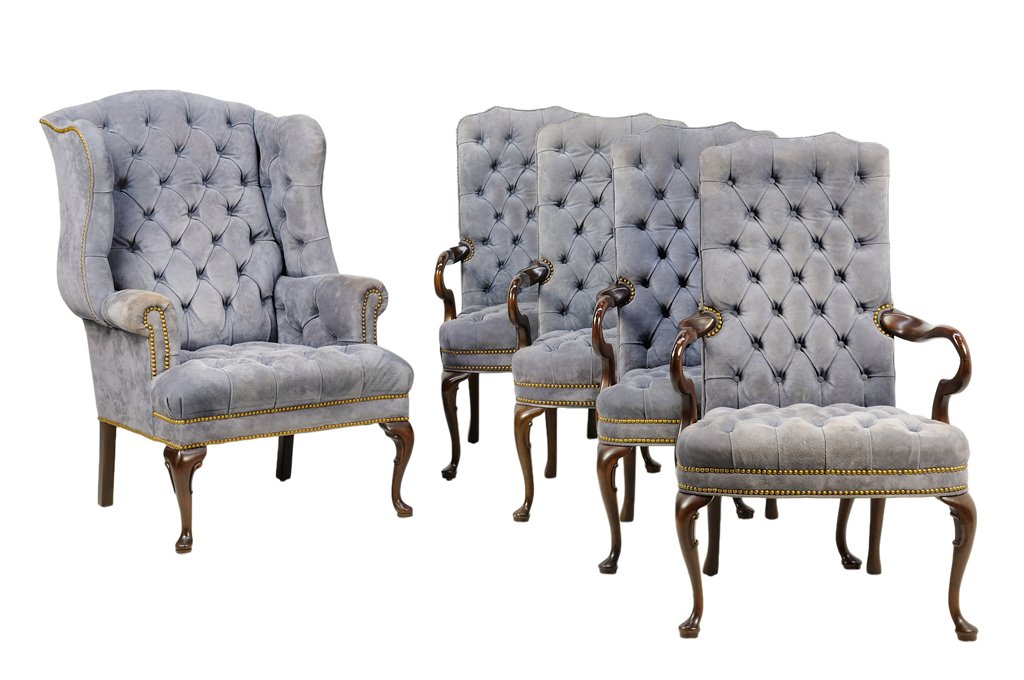 A SET OF FIVE QUEEN ANNE STYLE BUTTON TUFTED DINING: A SET OF FIVE QUEEN ANNE STYLE BUTTON TUFTED DINING CHAIRS The set comprising four open armchairs and a wingback armchair. Each chair having a curved crest rail over the button tufted back and seat, w