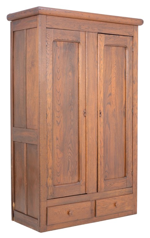 A PROVINCIAL STYLE OAK ARMOIRE: A PROVINCIAL STYLE OAK ARMOIRE The armoire having a straight cornice over two paneled doors, coffer paneled sides, above two short drawers, ending in a plinth base. H 74 x W 47 x D 21 inches.