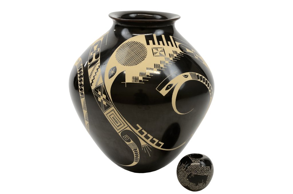 TWO MATA ORTIZ POTTERY VESSELS: TWO MATA ORTIZ POTTERY VESSELS Comprising a redware pottery vessel by Carlos Carrillo, having a gunmetal finish with buff painted geometric motifs over the black ground, signed to base, and a miniatur