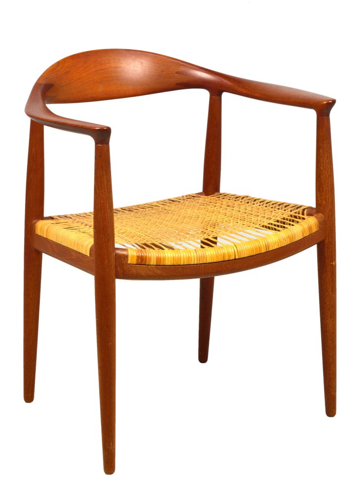 A HANS WEGNER FOR JOHANNES HANSEN CHAIR: A HANS WEGNER FOR JOHANNES HANSEN CHAIR Copenhagen, Denmark The Chair, Model 501, teak and caned armchair, the central stretcher with branded mark Johannes Hansen, Copenhagen, Denmark to one side, the