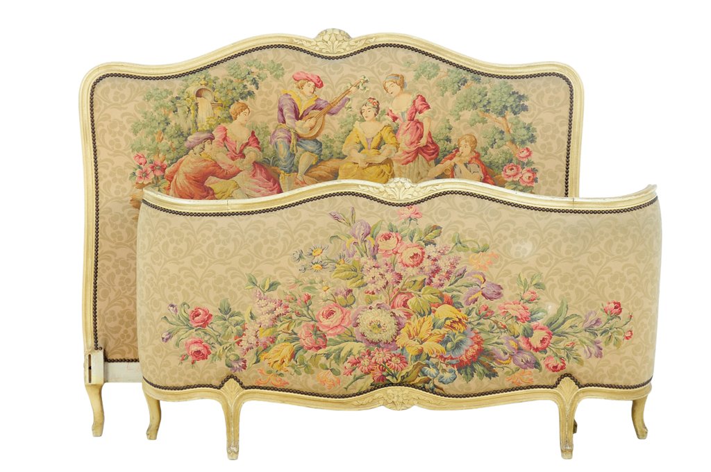 A FRENCH LOUIS XV STYLE PAINTED AND UPHOLSTERED BED: A FRENCH LOUIS XV STYLE PAINTED AND UPHOLSTERED BED The bed having a curved top rail centered with a foliate crest over the upholstered back panel depicting figures in a landscape. Comprising headboar