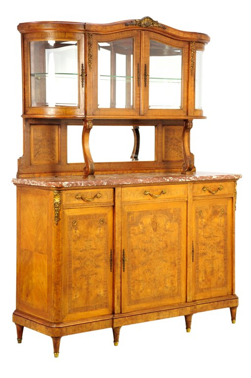 A FRENCH LOUIS XVI STYLE BUFFET A DEUX CORPS: A FRENCH LOUIS XVI STYLE BUFFET A DEUX CORPS The buffet a deux corps having a curved cornice centered with a gilt shell crest over four glazed doors, opening to a shelved interior, raised on serpentin