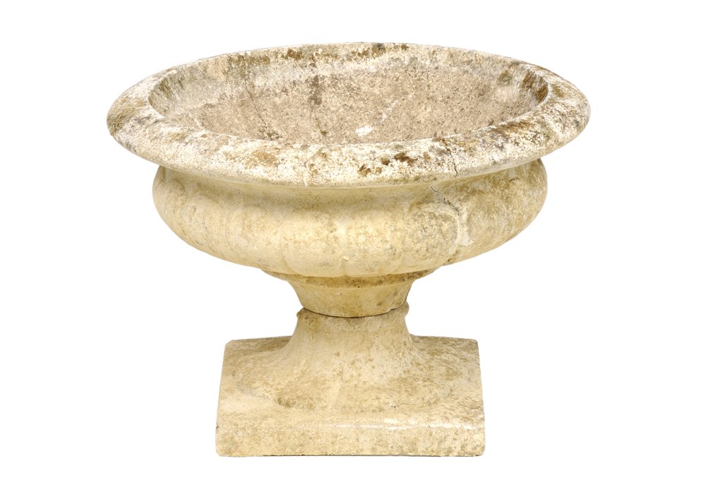 A CONCRETE MEDICI BASIN: A CONCRETE MEDICI BASIN The broad angled rim over the squat rounded body with a hemispherical bowl, supported by a short stem and outsplayed foot, on a square integral base. H 13½ x diam 20½ inches.