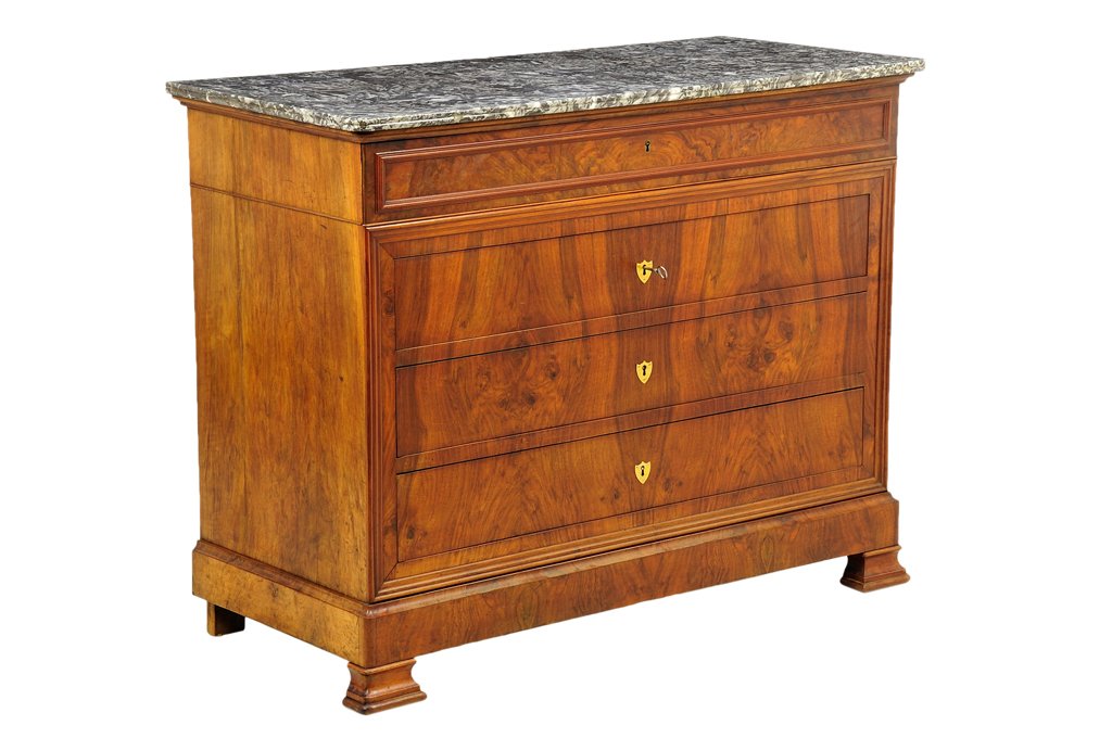 A FRENCH LOUIS PHILIPPE STYLE WALNUT COMMODE: A FRENCH LOUIS PHILIPPE STYLE WALNUT COMMODE The commode having a rectangular marble top over the conforming case, fitted with four drawers, gilt metal escutcheons, ending in a plinth base, raised on 