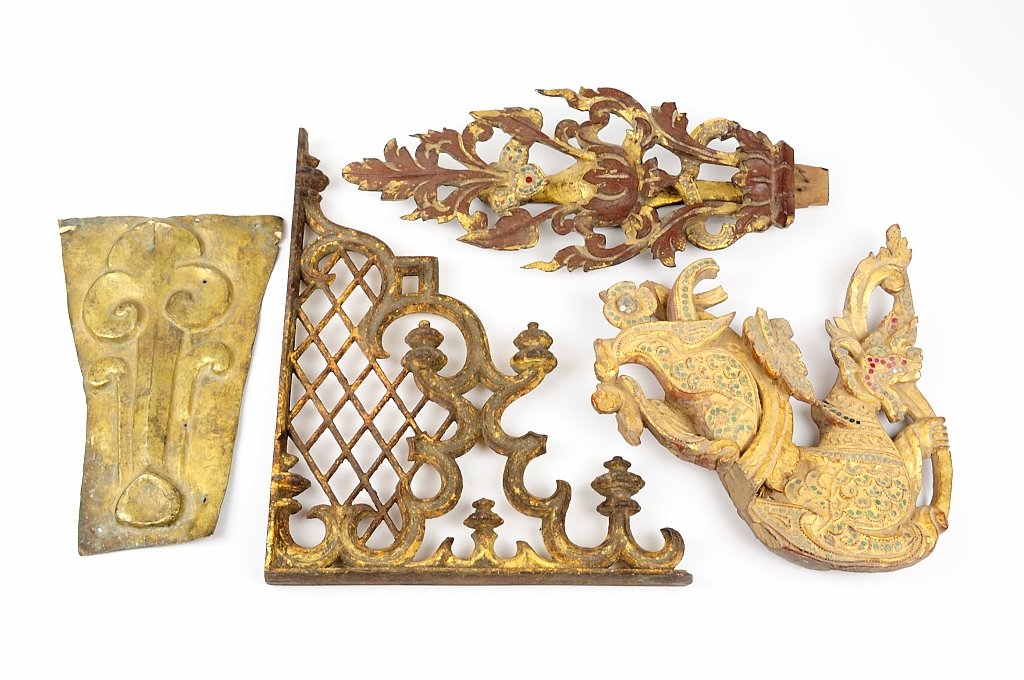 FOUR SOUTHEAST ASIAN ARCHITECTURAL ELEMENTS: FOUR SOUTHEAST ASIAN ARCHITECTURAL ELEMENTS Comprising two gilt metal examples and two jeweled parcel giltwood examples. H 14¾ x W 1½ x D 11½ inches. Provenance: Property from the Estate of George 