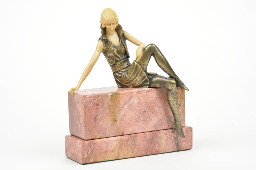 AN ART DECO STYLE PAINTED METAL AND IVORINE FIGURE ON: AN ART DECO STYLE PAINTED METAL AND IVORINE FIGURE ON MARBLE BASE After Ferdinand Preiss H 8¾ x W 7½ x D 2¾ inches. Provenance: Property from the Collection of H.R. Milne, Houston, Texas