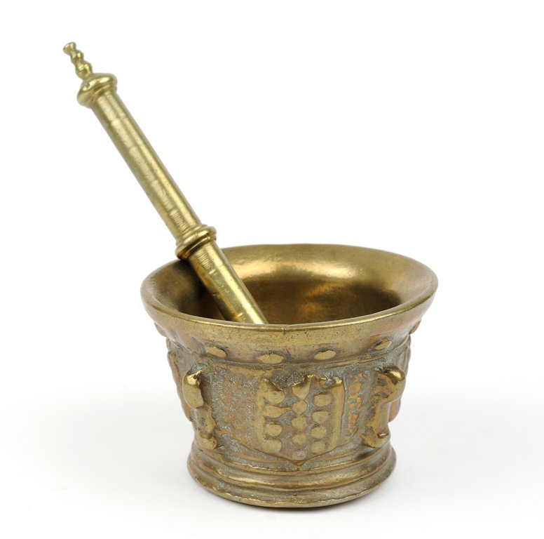 A SPANISH MORTAR AND PESTLE: A SPANISH MORTAR AND PESTLE 18th century The central register with four exterior lobe attachments between four stylized shields, and having a beaded upper register with splayed lip, the pestle of typi