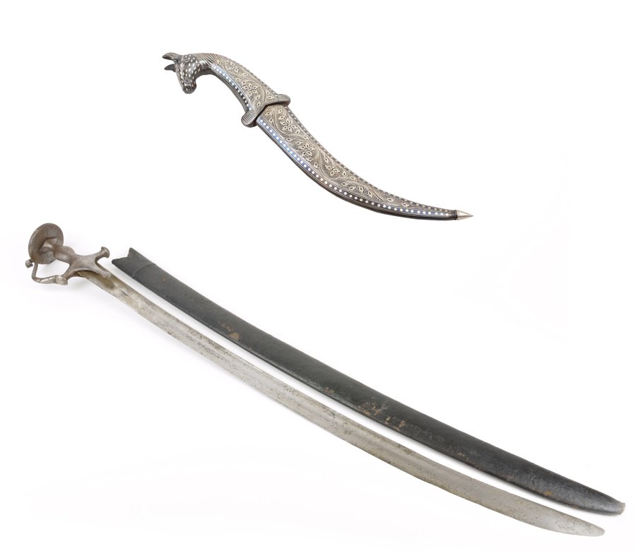 AN INDIAN TULWAR SWORD AND AN INDO-PERSIAN DAGGER: AN INDIAN TULWAR SWORD AND AN INDO-PERSIAN DAGGER Late 19th-early 20th century The Indian Tulwar sword having a curved steel blade terminating in the forged iron knucklebow and pommel disc hilt with f