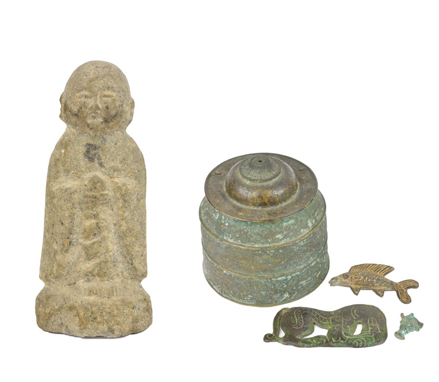 FOUR SINO-TIBETAN BRONZE ARTICLES AND A STONE BUDDHA: FOUR SINO-TIBETAN BRONZE ARTICLES AND A STONE BUDDHA FIGURE Comprising four bronze articles, including three figural items, the first depicting a fish, the second the head of an ox, the third a mythic