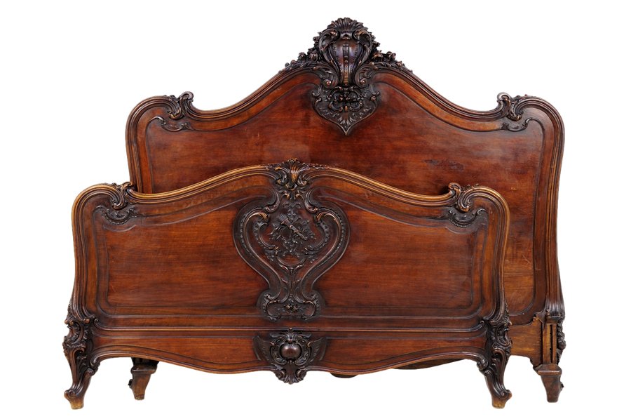 A FRENCH LOUIS XV STYLE ROSEWOOD BED: A FRENCH LOUIS XV STYLE ROSEWOOD BED The bed with carved rocaille and leaf decoration to top rail of headboard, raised on scrolled legs. Comprising headboard, footboard and side rails. W 61 x D 74½ i