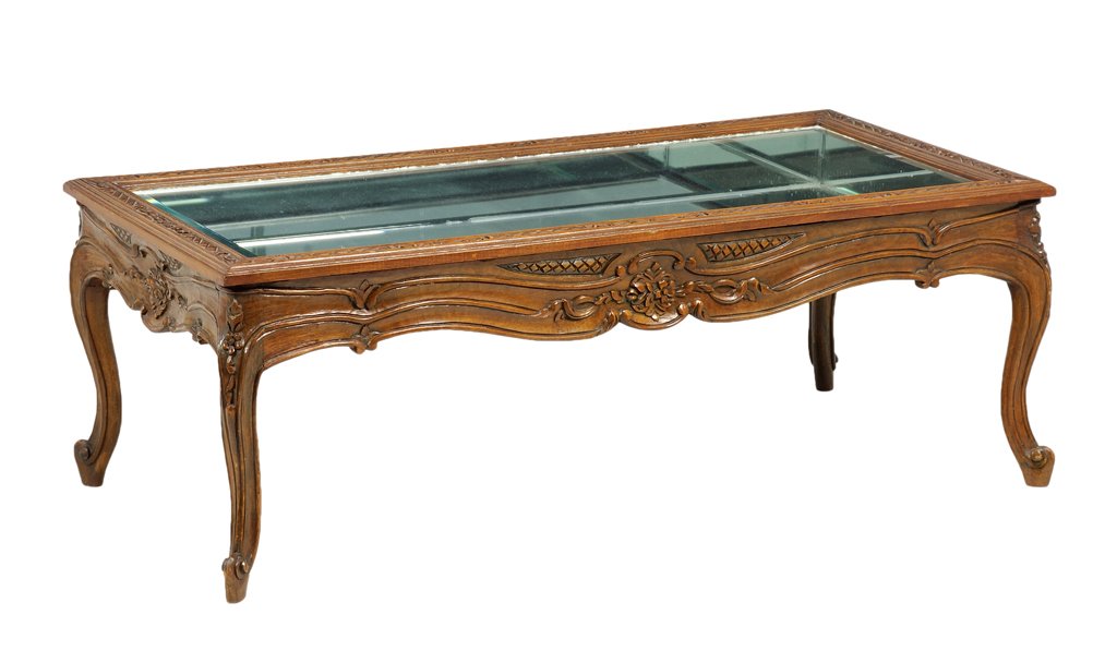 A FRENCH LOUIS XV STYLE MIRROR INSET LOW TABLE: A FRENCH LOUIS XV STYLE MIRROR INSET LOW TABLE The low table having a rectangular mirror inset top over the serpentine apron, carve with foliate decoration, raised on cabriole legs ending in scrolled