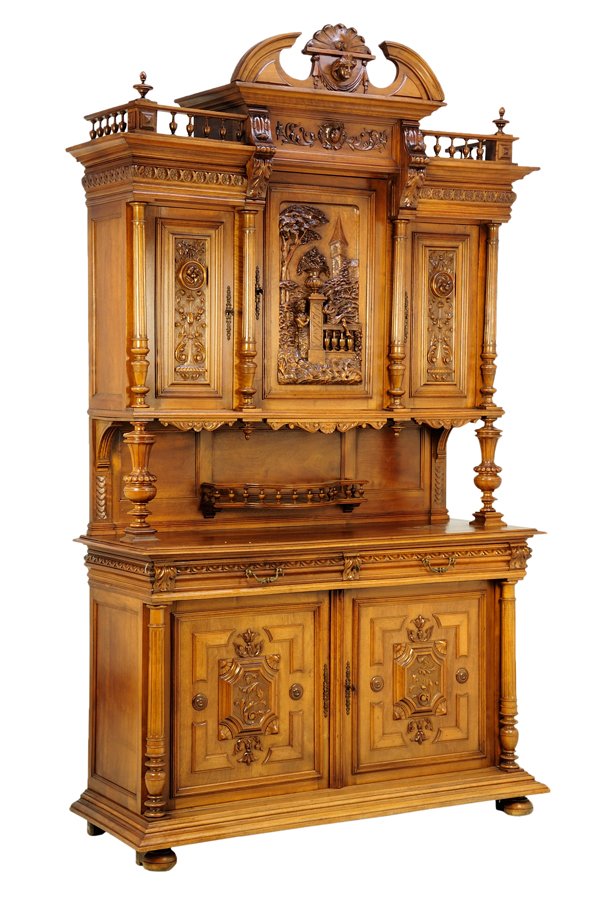 A RENAISSANCE REVIVAL WALNUT BUFFET A DEUX CORPS: A RENAISSANCE REVIVAL WALNUT BUFFET A DEUX CORPS The buffet a deux corps having a three-quarter gallery cornice centered with a broken arch, over the flared pediment, above three paneled doors, flanke