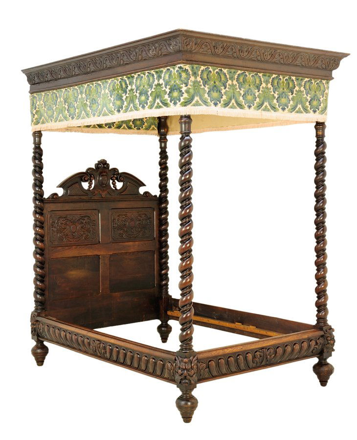 A RENAISSANCE REVIVAL CANOPY BED: A RENAISSANCE REVIVAL CANOPY BED The headboard having a broken arch top rail, with a foliate carved back panel. Having four barley twist supports, surmounted with the upholstered canopy. H 96 x W 62 x
