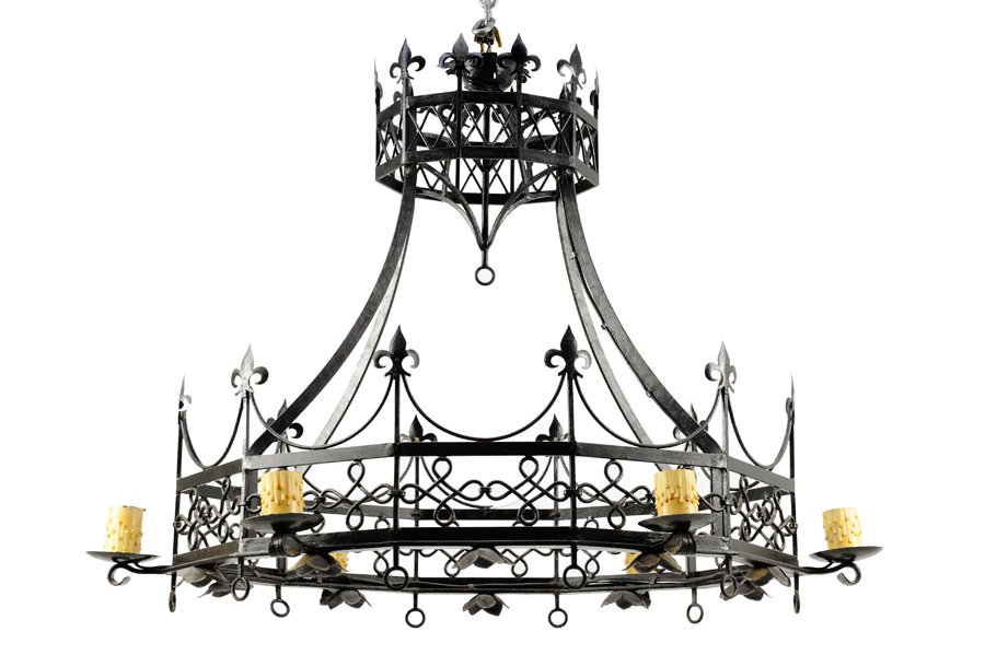 A GOTHIC REVIVAL IRON SIX-LIGHT CHANDELIER: A GOTHIC REVIVAL IRON SIX-LIGHT CHANDELIER Of cage form, the pierced lower surround issuing the six lights and surmounted by fleur-de-lis finials, surmounted by the conforming upper surround and joine