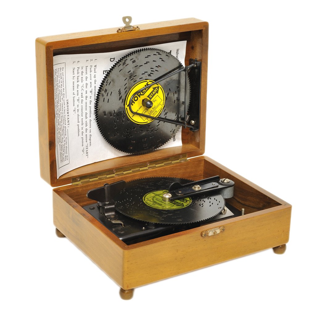 A SWISS THORENS AUTOMATIC DISC WINDUP MUSIC BOX