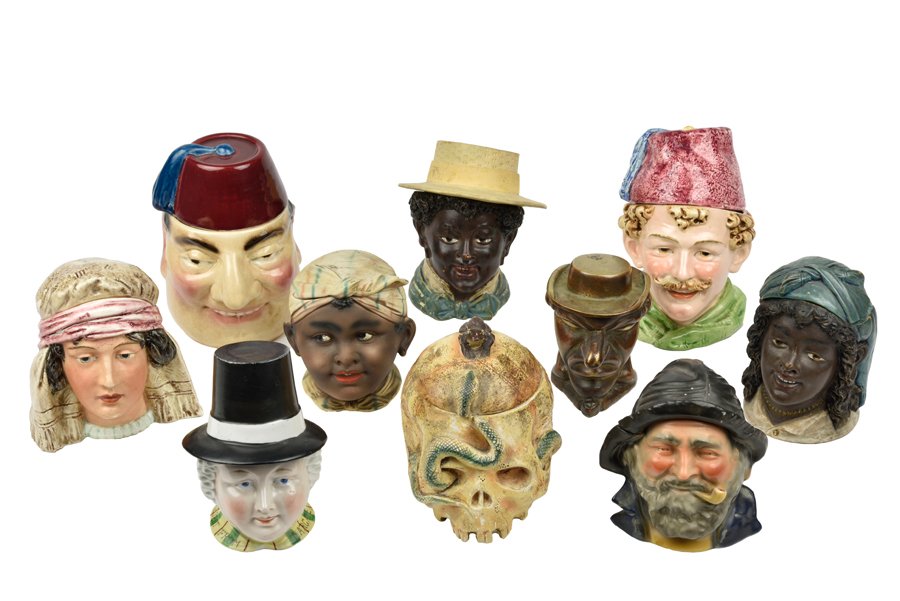 A COLLECTION OF TEN FIGURAL TOBACCO JARS: A COLLECTION OF TEN FIGURAL TOBACCO JARS Comprising nine ceramic examples of English and Continental origin, together with one bronze example. H 6¼ x W 4½ x D 6 inches. Provenance: Property from the