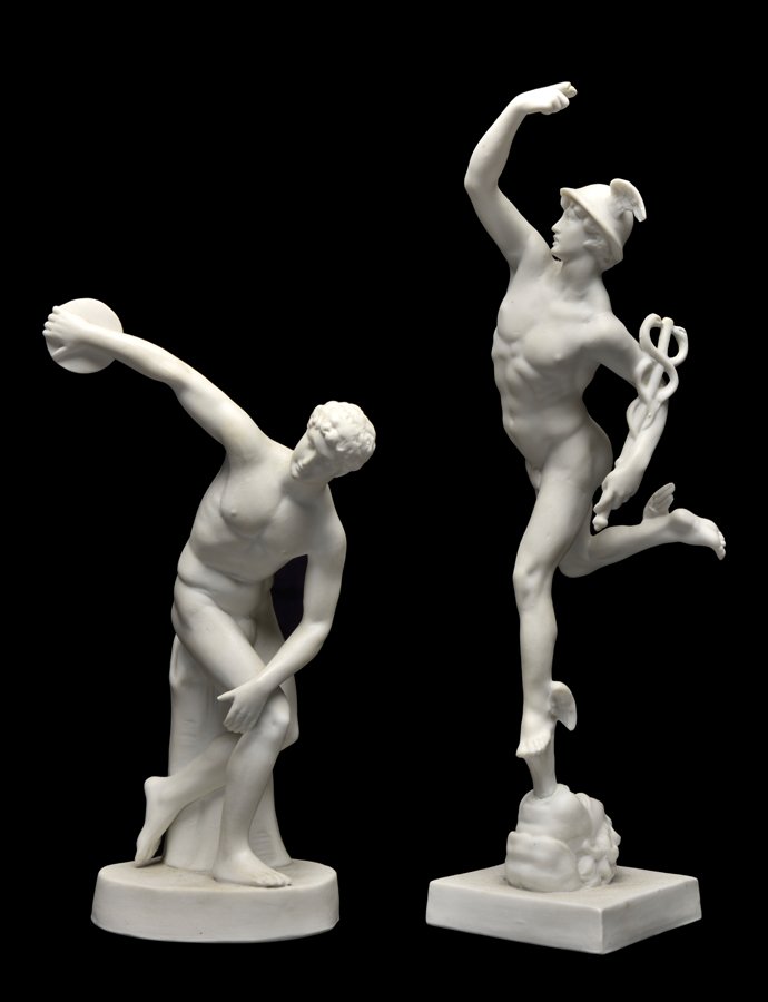 TWO PARIAN BISQUE PORCELAIN FIGURES: TWO PARIAN BISQUE PORCELAIN FIGURES Probably English, in the Classical taste, each raised on the integral base and apparently unmarked. H 11 x W 2¾ x D 3 inches.