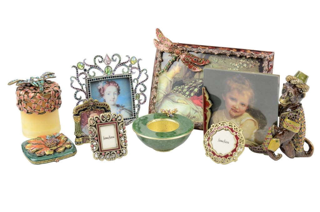 A COLLECTION OF JAY STRONGWATER JEWELED AND ENAMELED: A COLLECTION OF JAY STRONGWATER JEWELED AND ENAMELED ARTICLES The collection comprising six photo frames, two candle holders, and a compact. 9 pieces total Height of tallest 5½ x W 7 x D ¾ inches. P