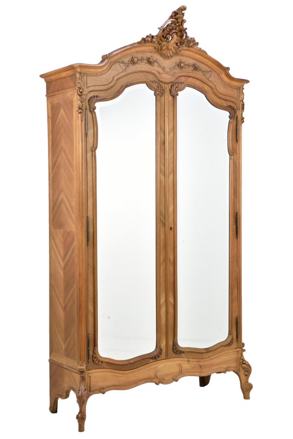 A FRENCH LOUIS XV STYLE PARQUETRY ARMOIRE: A FRENCH LOUIS XV STYLE PARQUETRY ARMOIRE The armoire having a pierce carved acanthus leaf crest over the stepped cornice above the conforming case fitted with two mirror plate inset doors, over the s