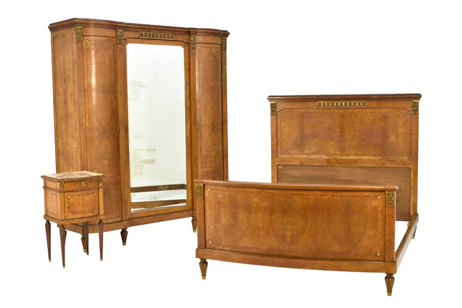 A FRENCH LOUIS XVI STYLE BEDROOM SUITE: A FRENCH LOUIS XVI STYLE BEDROOM SUITE The set comprising a beds, an armoire and a bedside cabinet. Each having gilt metal foliate mounts, raised on cylindrical tapering legs. H 84½ x W 73 x D 22½ i