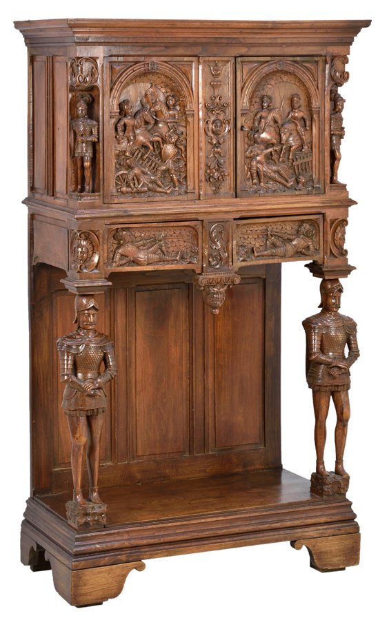 A RENAISSANCE REVIVAL CABINET ON STAND: A RENAISSANCE REVIVAL CABINET ON STAND The cabinet having a flared cornice over the figural carved paneled doors, flanked by standing figures, above two short drawers carved with recumbent figures, ra