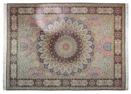 AN IRANIAN TABRIZ SILK AND WOOL RUG: AN IRANIAN TABRIZ SILK AND WOOL RUG The rug having a central lobed foliate medallion on an ivory ground with repeating geometric decoration, within multiple borders, with fringe to both ends. 8ft 3in