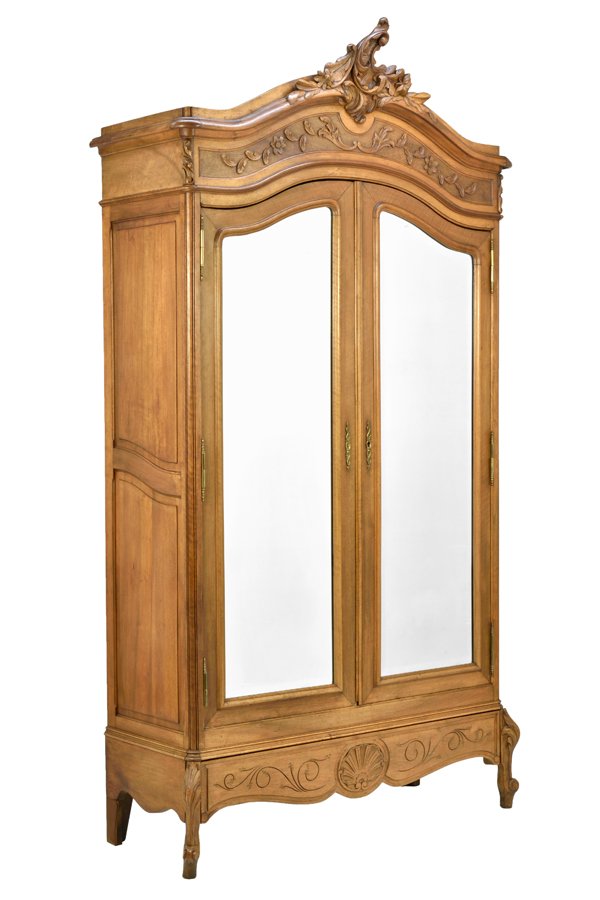 A FRENCH LOUIS XV STYLE ARMOIRE: A FRENCH LOUIS XV STYLE ARMOIRE The armoire having a carved acanthus leaf crest over the domed cornice and the conforming case fitted with two mirror plate inset doors, over the serpentine apron, rais