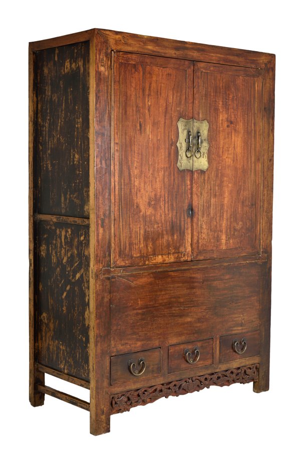 A CHINESE CARVED HARDWOOD CABINET: A CHINESE CARVED HARDWOOD CABINET The carved tall compound cabinet, of rectangular form, with three drawers on the bottom section, raised on squared legs, joined by a carved pierced apron at the front