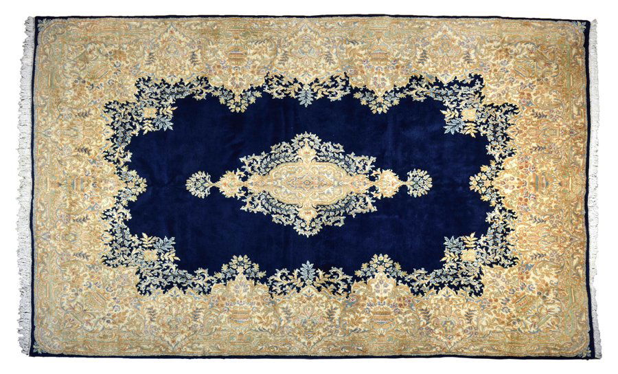 A KIRMAN WOOL RUG (1 of 3)