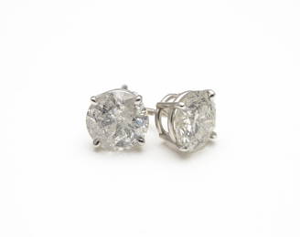 A PAIR OF DIAMOND SOLITAIRE EARRINGS