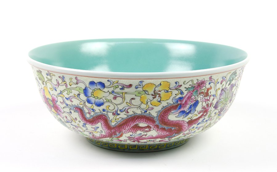 A LARGE CHINESE FAMILLE ROSE BOWL: A LARGE CHINESE FAMILLE ROSE BOWL 20th century Depicting flying dragons in floral motif, the interior was painted in turquoise color, six characters Qian-long reign mark on bottom. H 6½ x diam 16½ i