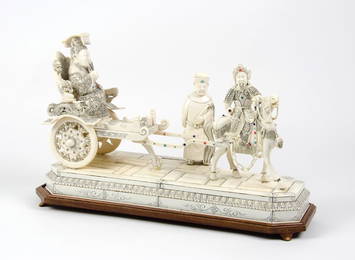 A CHINESE CARVED IVORY FIGURAL GROUP