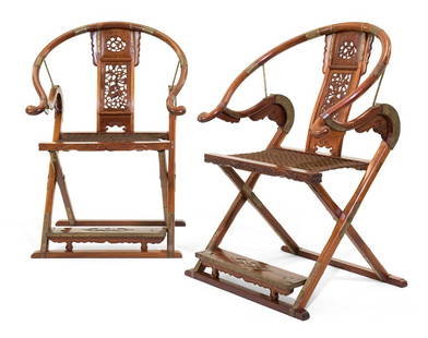 A PAIR OF CHINESE HORSESHOE BACK CHAIRS: A PAIR OF CHINESE HORSESHOE BACK CHAIRS The horseshoe back chairs having metal mounts to the rounded crests, the vertical plank backsplats pierce carved with beasts amongst foliage, the horizontal sla