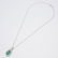 AN EMERALD AND DIAMOND PENDANT WITH CHAIN - 2