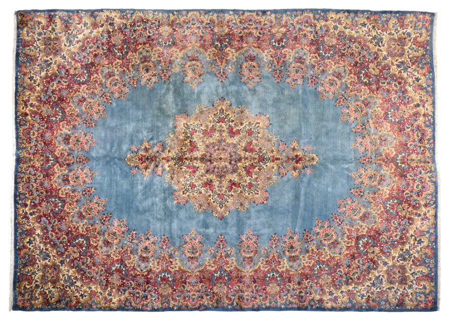 A KIRMAN WOOL RUG (1 of 4)