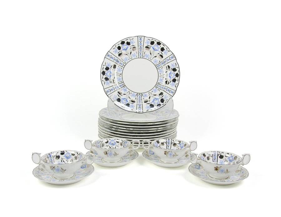 A WEDGWOOD PORCELAIN DINNER SERVICE FOR TWELVE: A WEDGWOOD PORCELAIN DINNER SERVICE FOR TWELVE Mid-20th century Comprising 12 dinner plates, 12 consommes and 12 underplates. Each with blue and silver foliate decoration, pattern W2997, with Portland